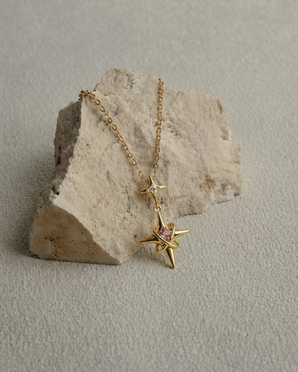 A multi-pointed star with orbiting rings and a pink centre stone. Anti-tarnish and waterproof, at Rs 539 — premium quality at an accessible price. Shop Zorelle India.